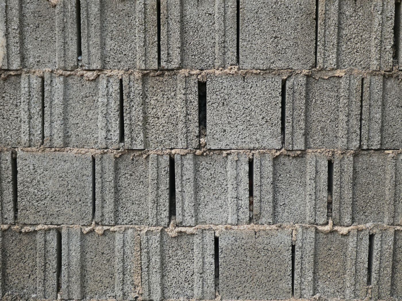 Stacked grey cement hollow blocks