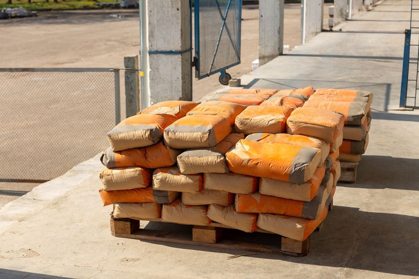 Pallets of bagged cement and plaster in the Sze Leong yard