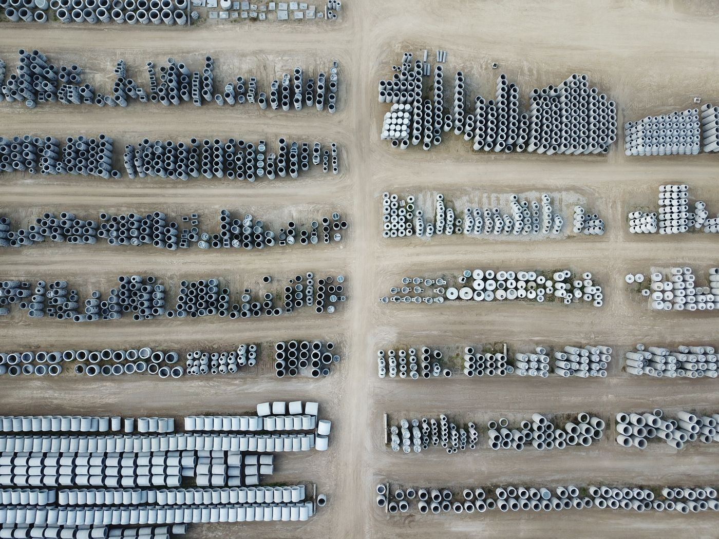 uPVC pipes stacked at a construction site