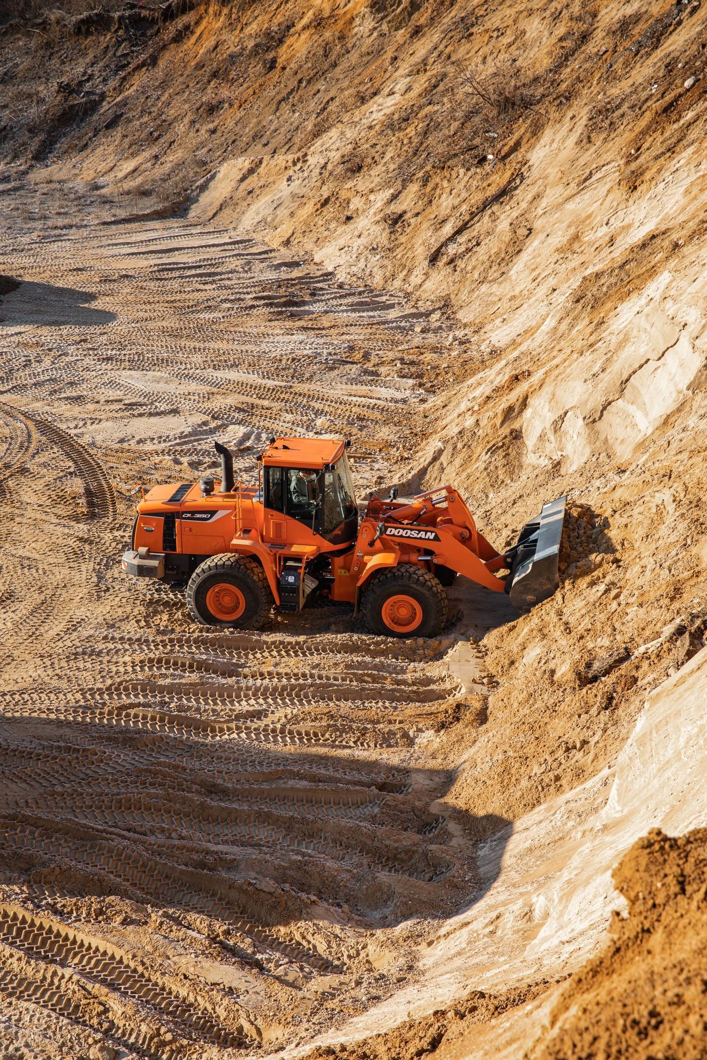 Wheel loader working a materials stockpile in the yard